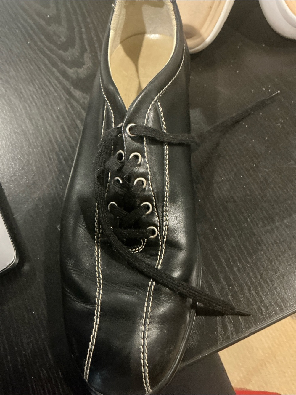 Tod's black leather driving sneaker. Great walking shoes, especiallynif it's rai